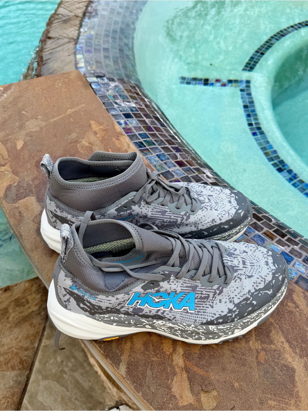 Hoka Women’s Speedgoat 6 Gray Sneakers with Blue Logo